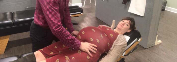 Chiropractor Greensboro NC David Huff Adjusting Amanda Huff While Pregnant