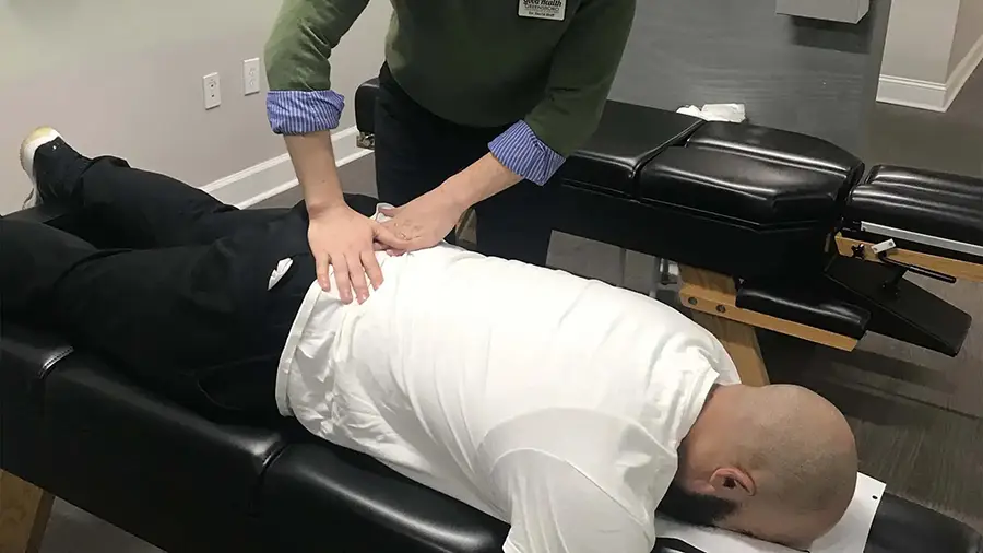 Chiropractic Special Offer Greensboro NC David Huff with Patient